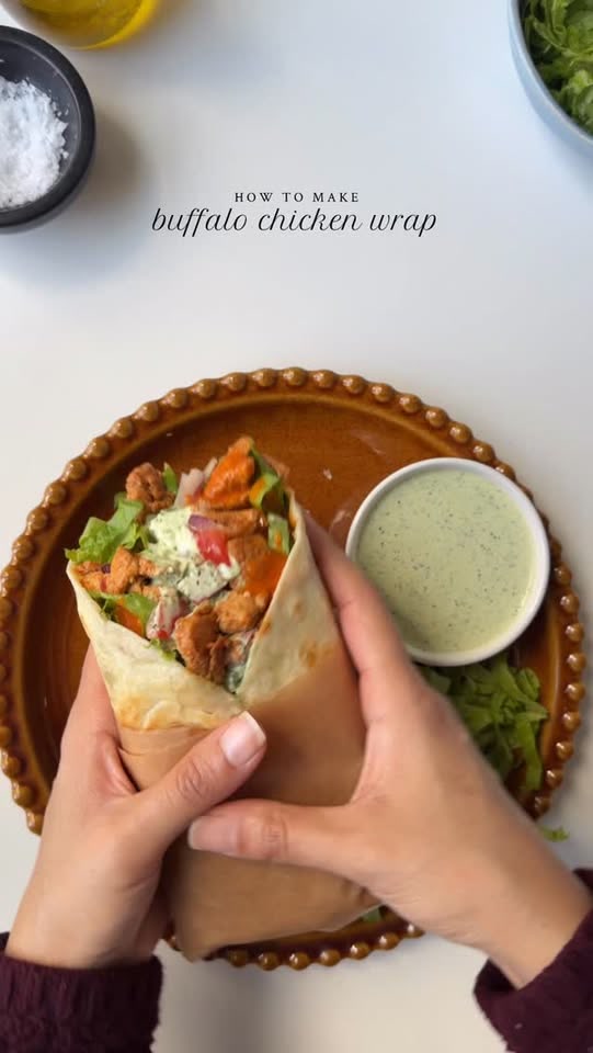 Buffalo chicken wrap with cilantro & lime crema