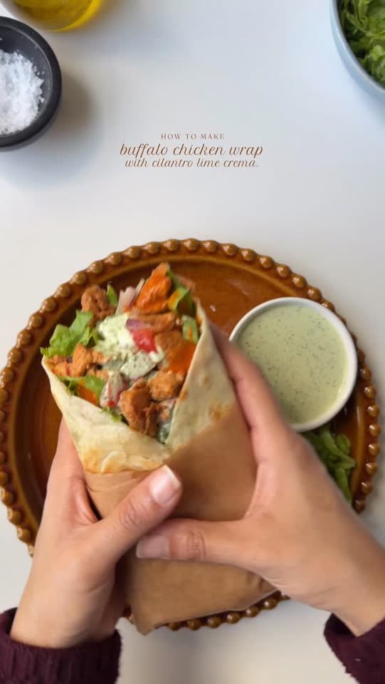 Buffalo chicken wrap with cilantro lime crema