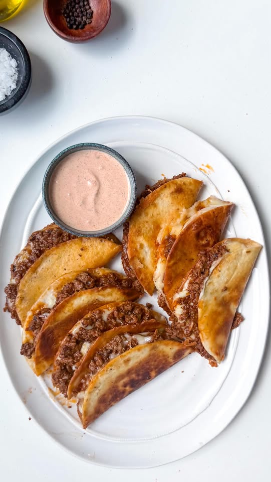 Crispy beef tacos with pico de gallo and cream taco sauce