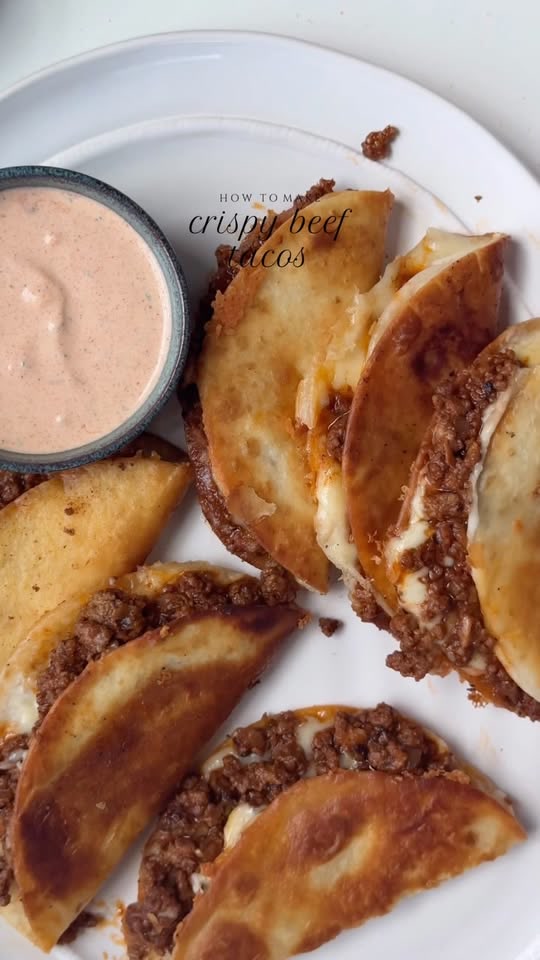 Crispy beef tacos with pico de gallo and cream taco sauce