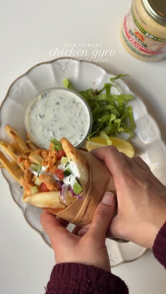 Juicy, perfectly spiced chicken gyro with creamy tzatziki wrapped in w